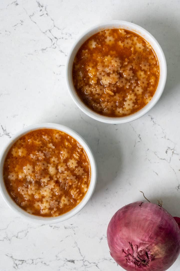 This Mexican Star Soup (Sopa de Estrellas) is made with red onions, garlic, diced tomatoes, chicken broth, and star pasta.