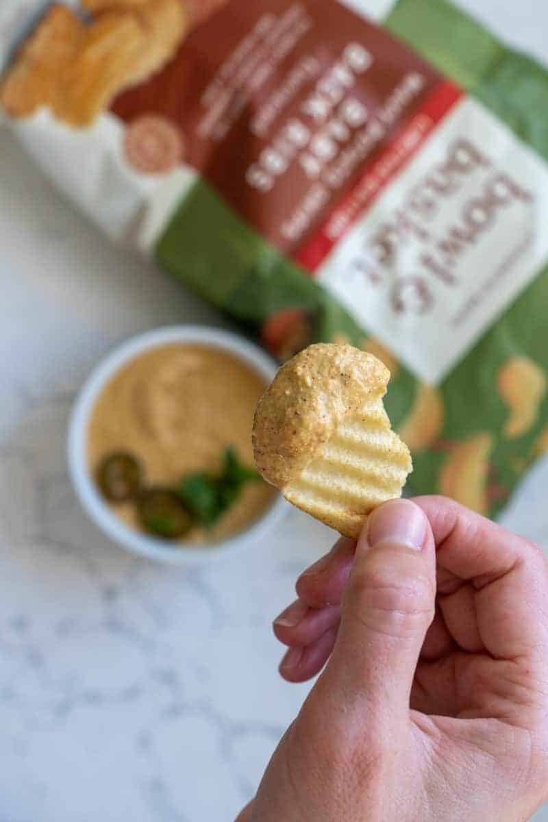 This Vegan Queso Recipe is made with cashews, garlic, nutritional yeast, chipotle peppers, chili powder, paprika, and blended.