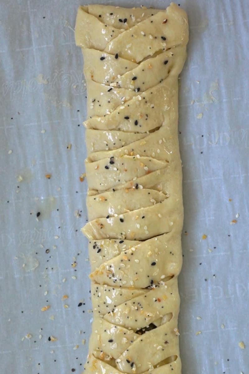 Fold both ends at the top and bottom over the filling, to prevent any spilling. Braid the rest of the way down the bread.