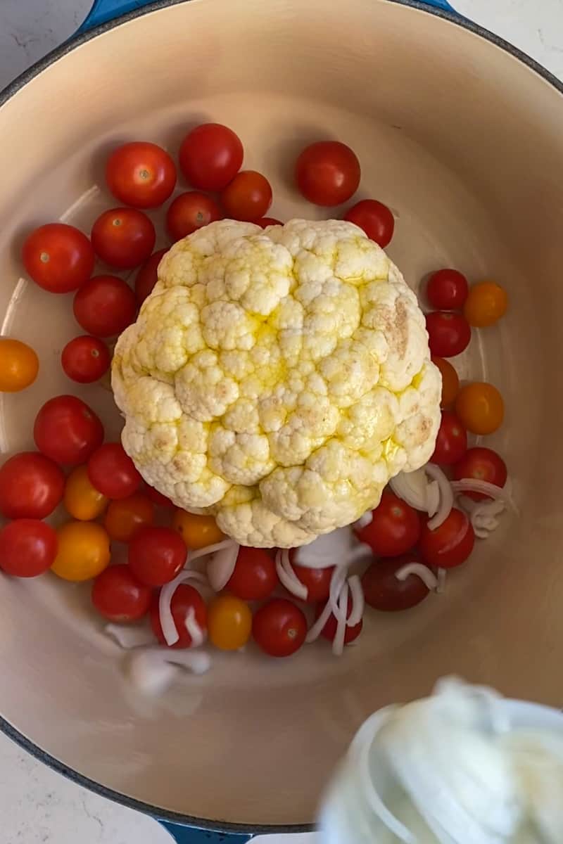 Preheat the oven to 400°F.Cut off the bottom of the stem of the cauliflower and break off any of the outer leaves. Carefully cut out the hard core of the cauliflower, near the bottom. Leave the main stem intact and make sure not to cut through florets.