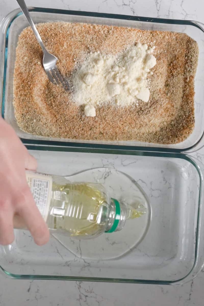 In a small shallow dish, mix together the paprika, shake and bake, parmesan, and thyme.