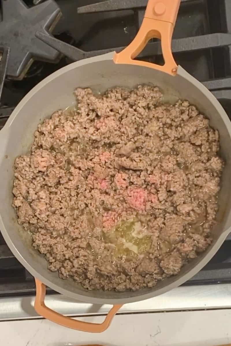 In a large deep skillet on medium high heat, vegetable oil and wait for it to shimmer. Add the ground pork and stir until brown, around 5 minutes.