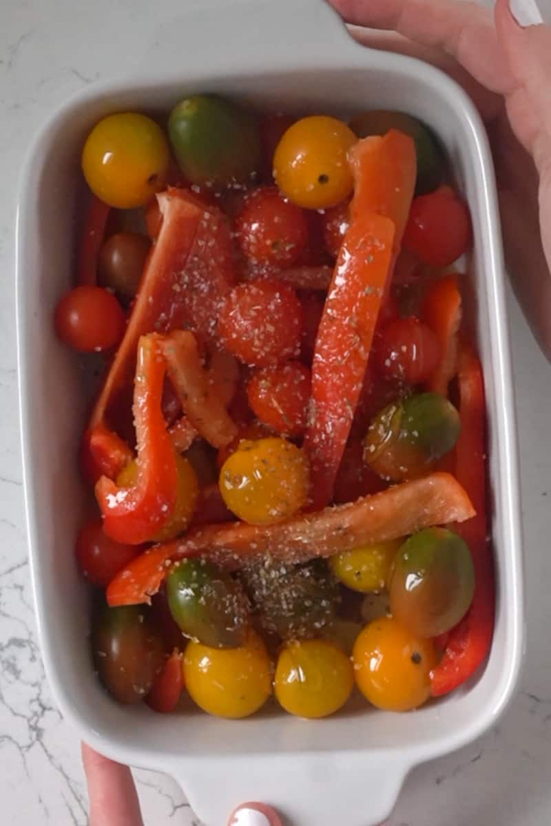 In a small baking dish, add the olive oil, bell peppers, tomatoes, garlic, oregano, balsamic vinegar, honey and salt. Combined well and bake in the oven for 20-30 minutes, until the tomatoes are bursting and the pepper is soft. 