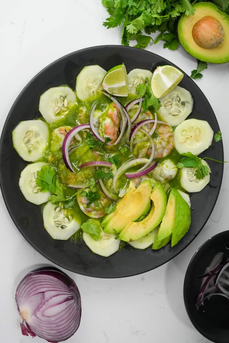 This Shrimp Aguachile Recipe (Aguachile de Camarón) is made with jalapeños, limes, cilantro, shrimp, cucumber and onion.