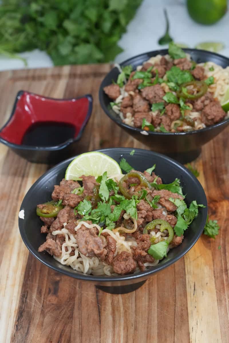 These Ground Beef Ramen Recipe is made with ramen, ground beef, hoisin sauce, sriracha, jalapeños, lime juice, and cilantro.
