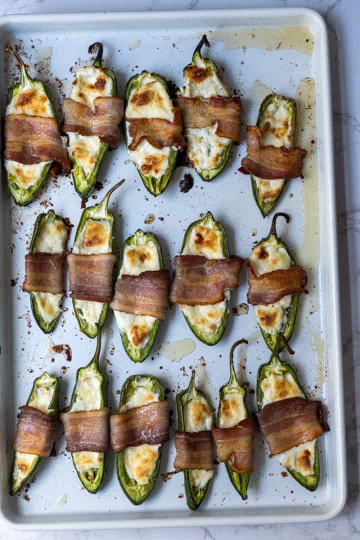 These Jalapeño Poppers with Cheddar Cheese (Air Fryer and Oven) are made with jalapeños, cream cheese, sharp cheddar cheese, bacon and air fried to crispy goodness.