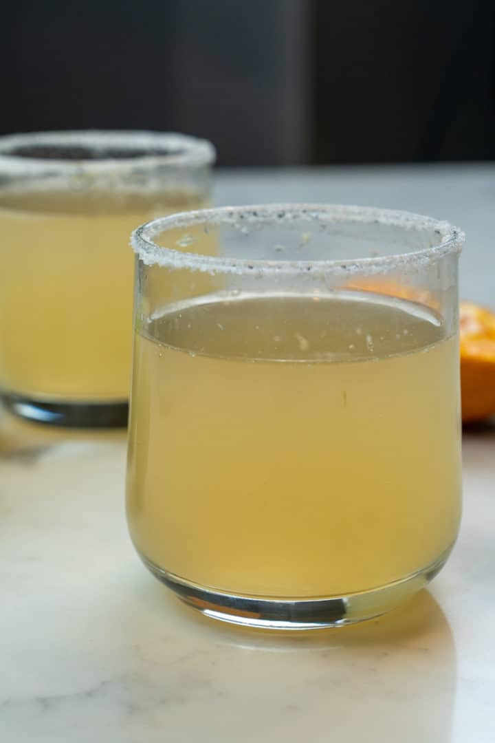 This Jalapeño Margarita Mocktail is made with lime juice, grapefruit juice, jalapeño simple syrup, and Tajin.