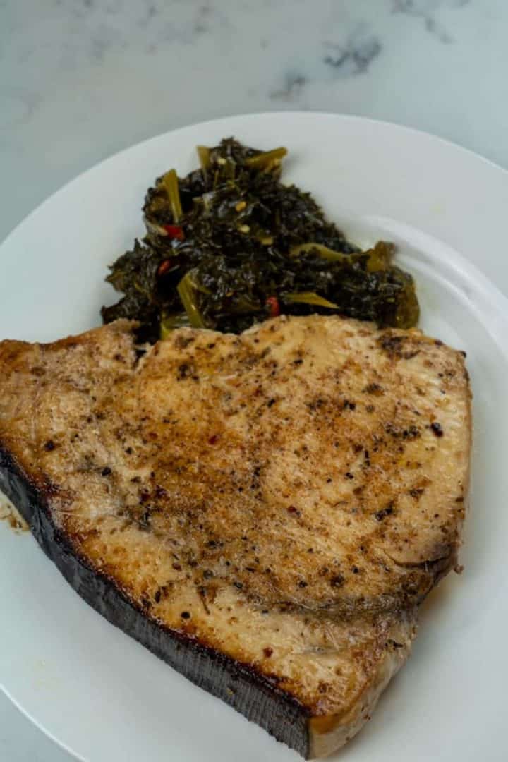 These Blackened Swordfish Steaks are made with swordfish steaks, salt, pepper, Cajun seasoning, a greased baking sheet, and broiled to perfection.