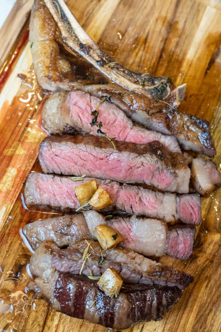 This Reverse Sear Steak Recipe is made with a thick piece of cowboy steak, grapeseed oil, butter, garlic, thyme and baked and seared to perfection.