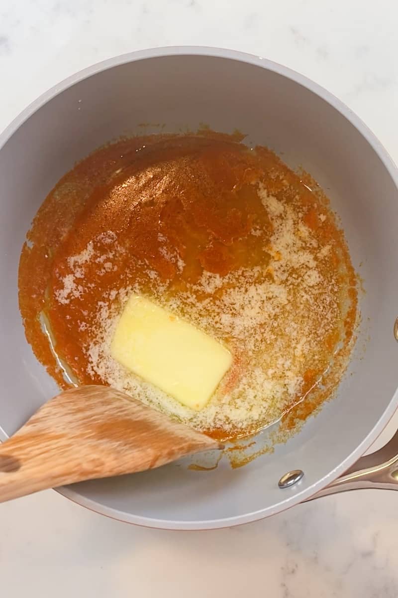 Optional: Meanwhile, if you are making your own buffalo sauce, take the time as the chicken is air frying to melt the butter and hot sauce. In a large saucepan on medium low heat, add the stick of butter and the hot sauce, for 10 minutes, and keep stirring until the butter slowly melts.