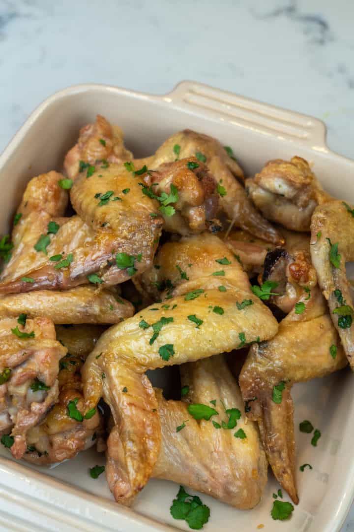 These Vietnamese Chicken Wings are made with chicken wings, baking powder, garlic powder, fish sauce, sugar, limes, mint and cilantro.