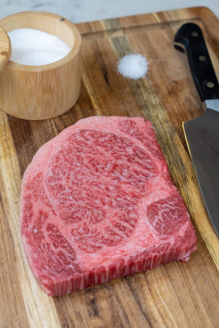 On the highest heat on your cast iron, let it heat up until smoking. Add the optional butter if you want (wagyu is highly fatty so it is not necessary).  Sear the beef for 2-2 ½ minutes on each side, until 125°F for rare. For medium-rare it is 135°F, for medium it is 145°F, or for medium-well it is 150°F.