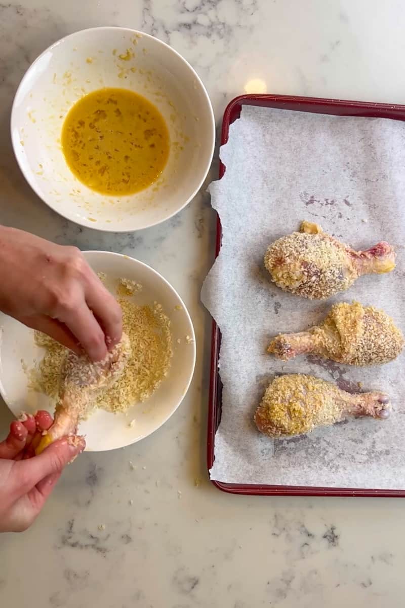 In another bowl, mix the panko crumbs, garlic powder and onion powder. Dip the drumsticks into the egg mixture, then dredge the drumsticks in the crumbs.