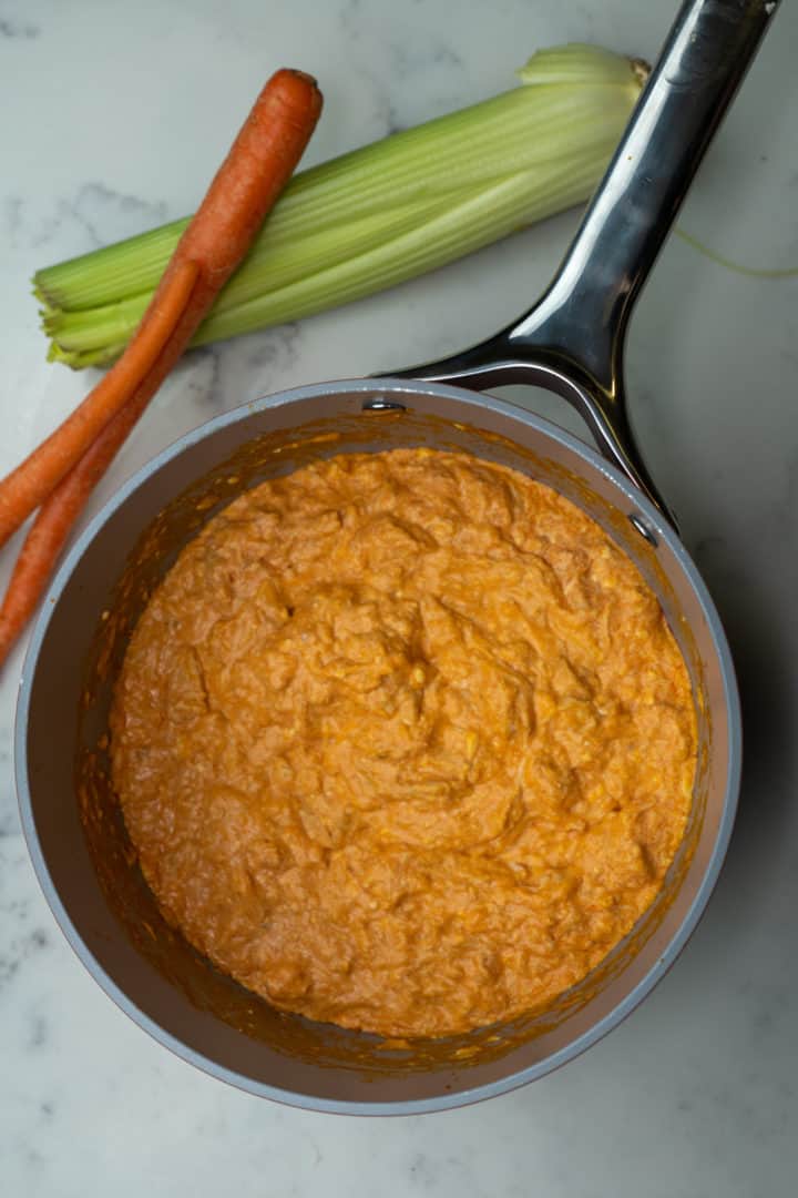 This Buffalo Chicken Dip without Ranch (Keto) is so easy to make and only needs four ingredients: shredded chicken, cream cheese, hot sauce and butter.