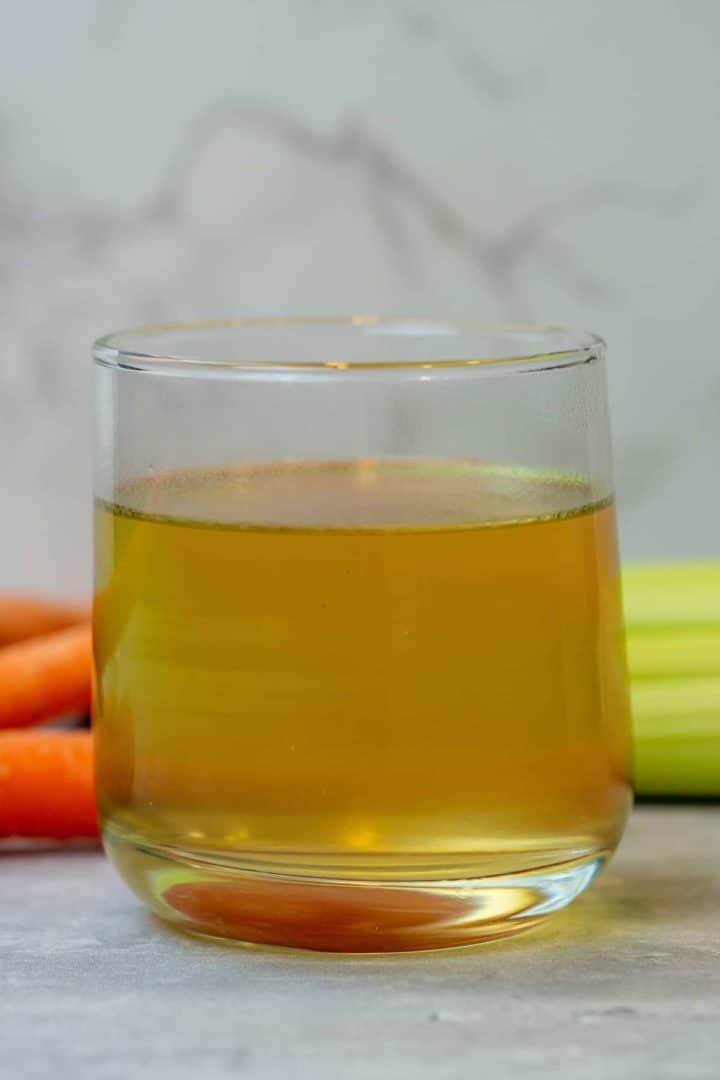 This Bone Broth Recipe (Instant Pot) is made with a carcass of a chicken, carrots, celery, and herbs in an Instant Pot.