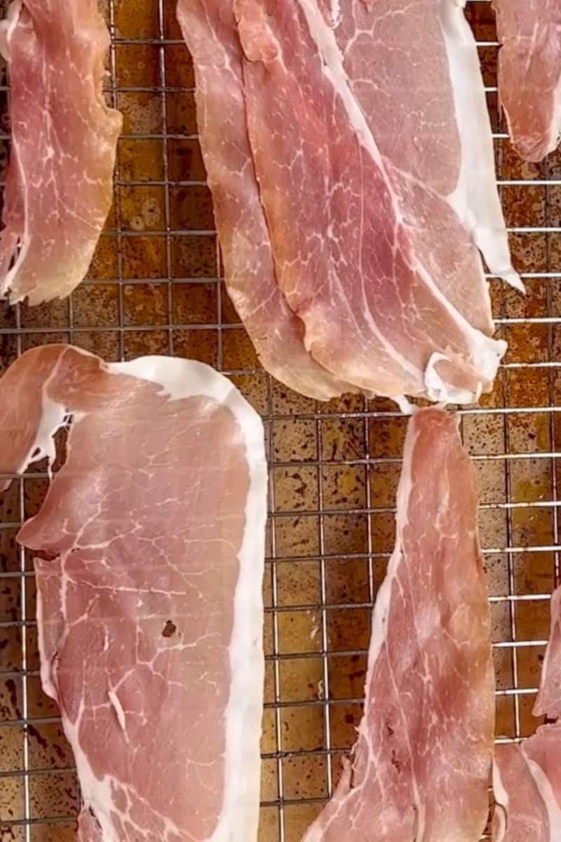 Bake the prosciutto. Cook prosciutto for 8-10 minutes at 375 F and set on a plate with a paper towel.