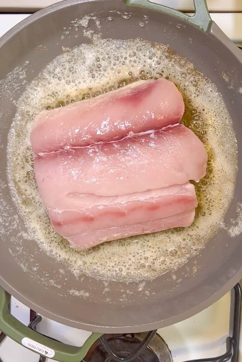 Please start by patting the mahi mahi dry on a plate with paper towels. You want to get rid of excess moisture so the fish doesn’t release water. In a large skillet, start by cooking the mahi mahi with 1 tablespoon of olive oil. Cook for 3-5 minutes on each side, depending on the thickness. Remove the mahi mahi and set on a plate. 