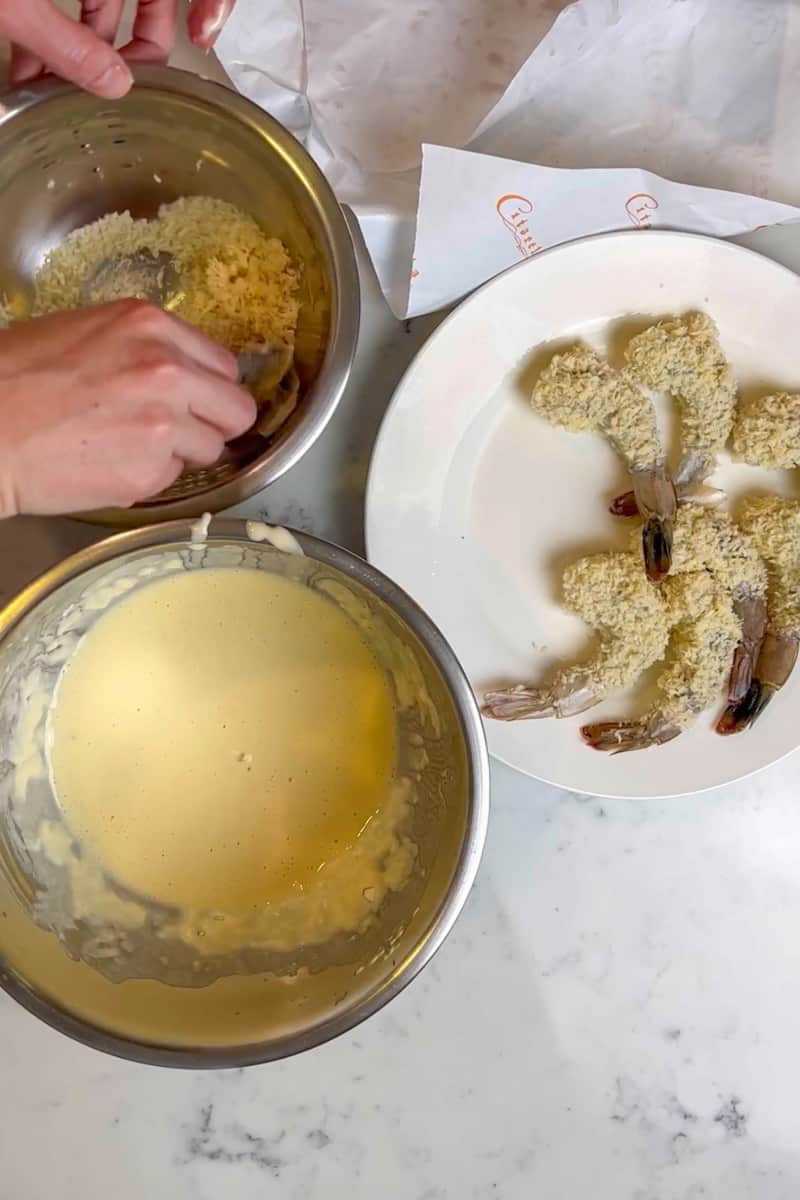 Dip the shrimp into the batter and then toss into the panko crumbs. Repeat with the rest of the shrimp.