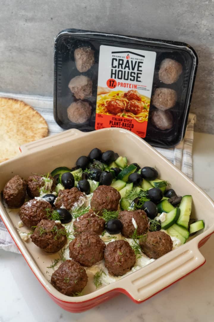 These Greek Vegetarian Meatballs with Feta are made with plant based meatballs, black olives, cucumbers, dill, and served on a delicious feta whip.