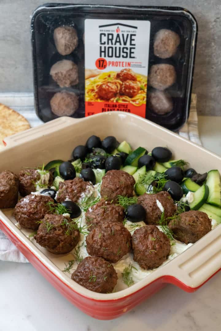 These Greek Vegetarian Meatballs with Feta are made with plant based meatballs, black olives, cucumbers, dill, and served on a delicious feta whip.
