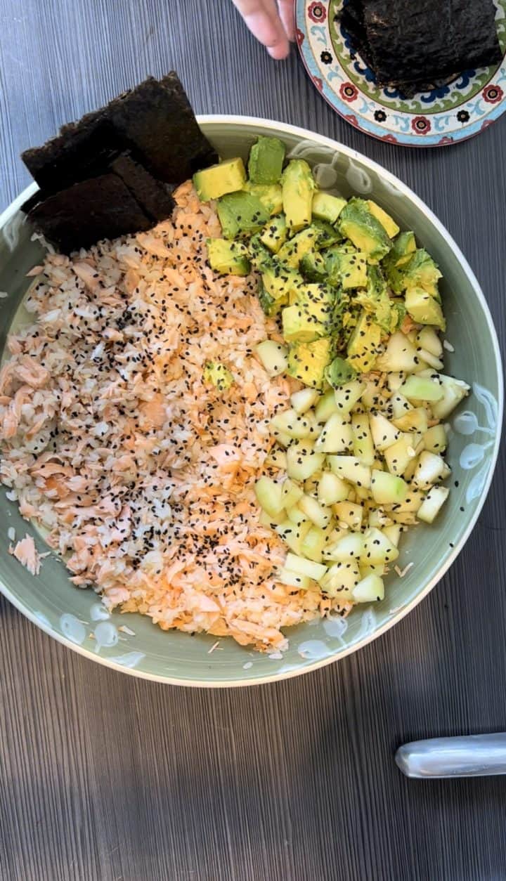 I gave this a little spin of my own, baking the salmon in a ginger, garlic, soy sauce, rice vinegar and sesame mixture. Enjoy this Tiktok Salmon Rice Bowl with Seaweed.