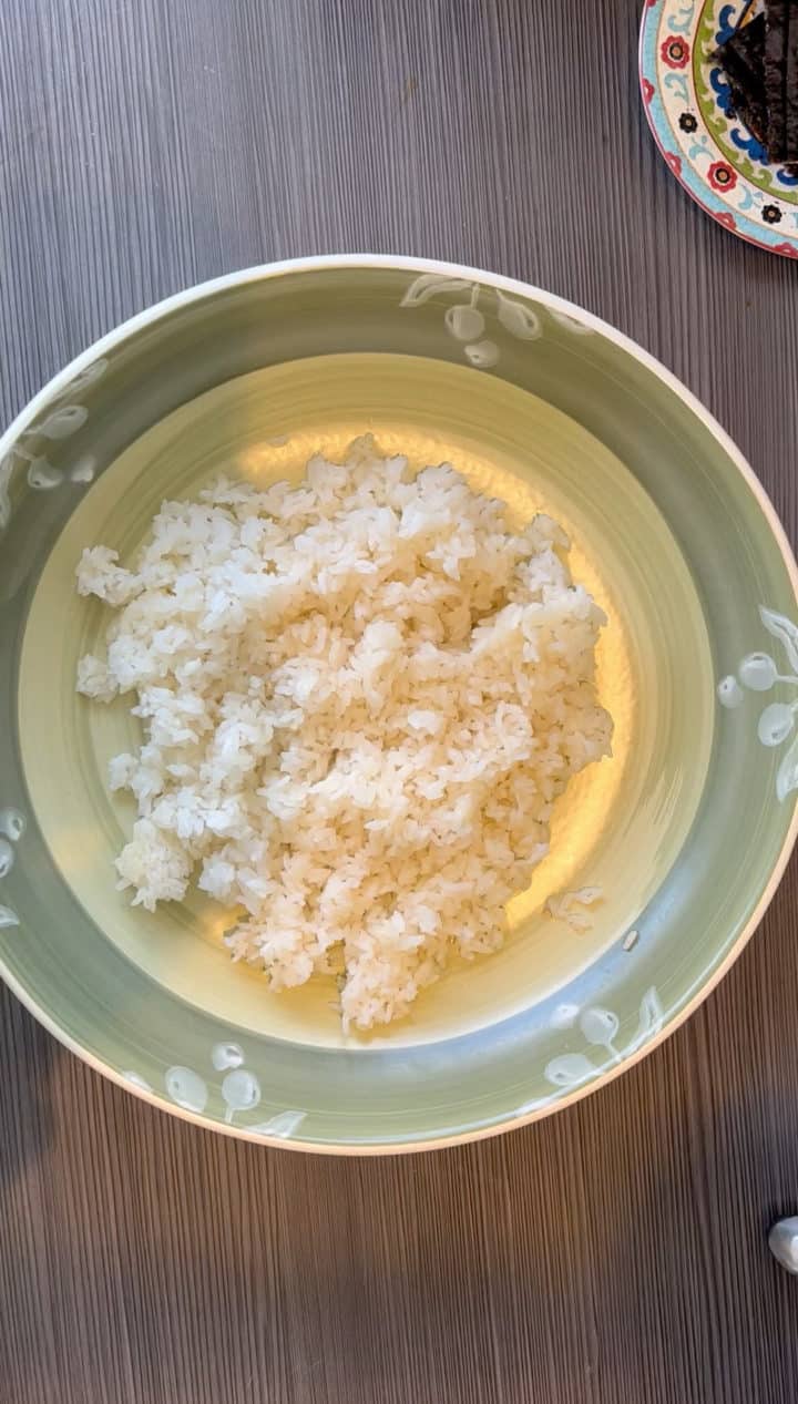 Cook the sushi rice according to package instructions. This could mean having to rinse for 30 minutes beforehand. Make sure to read the label as every rice brand instructions are different. Let it sit in the lidded pot until ready to serve. No peeking!