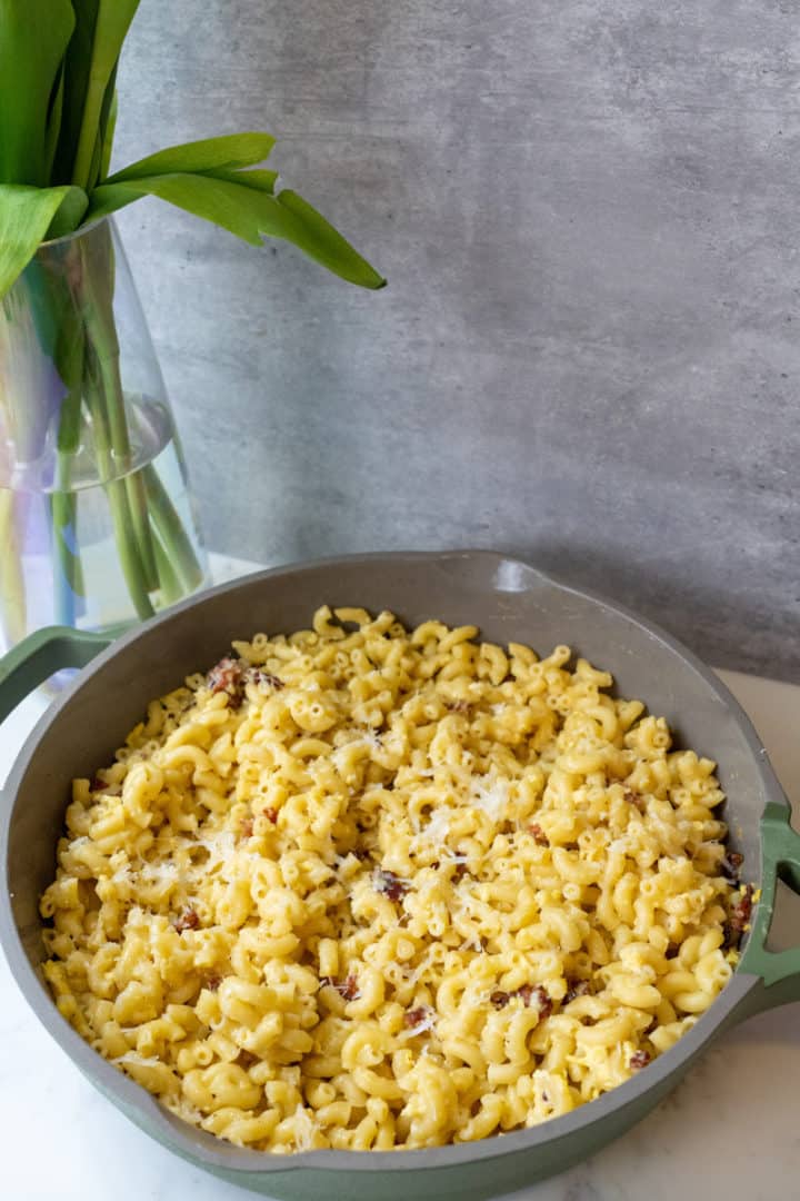 This Carbonara Macaroni is made with eggs, Pecorino Romano, parmesan, pepper, olive oil, bacon and al dente macaroni.
