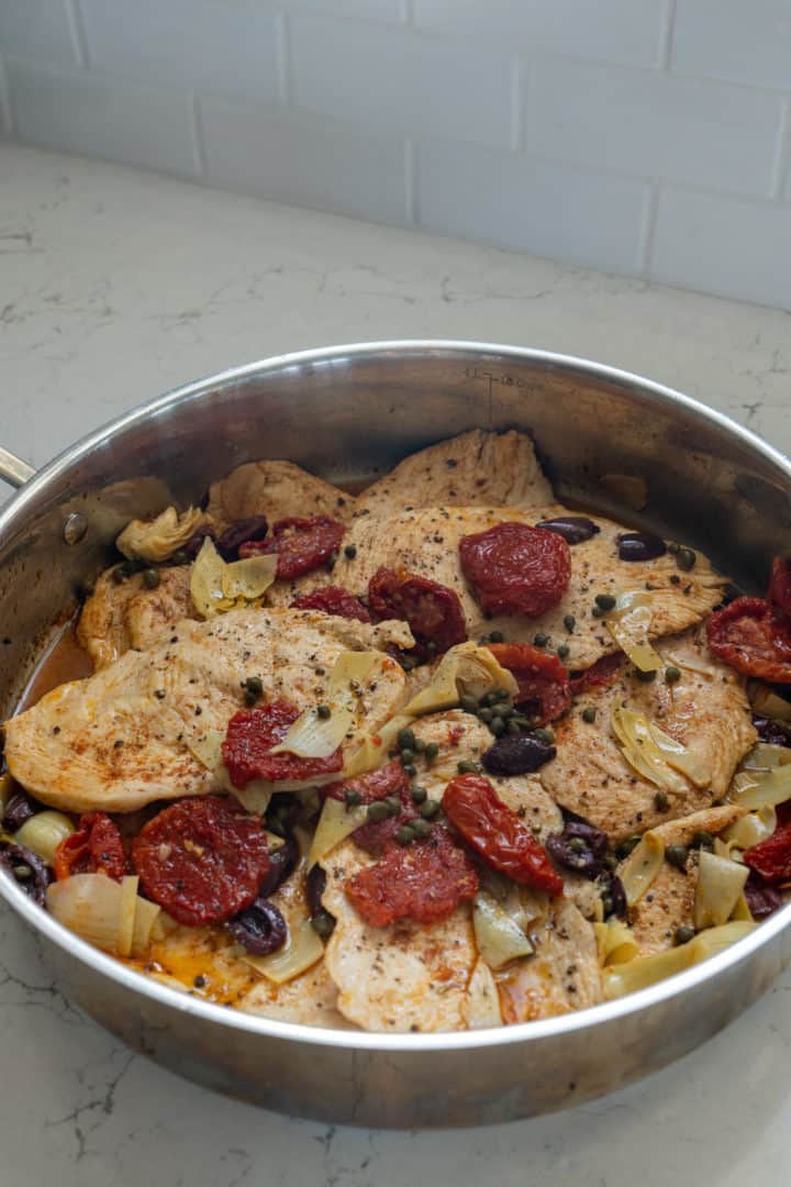 This Chicken Piccata (Keto and Gluten Free) recipe is made with thinly sliced chicken, paprika, sun-dried tomatoes, capers, artichokes and lemon juice.