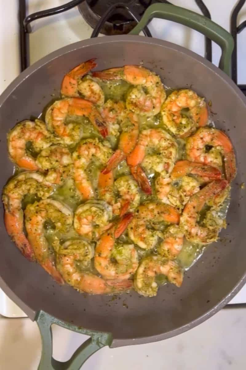 Heat up the butter on another skillet for the shrimp. With a slotted spoon, place the shrimp and then cook 2-3 minutes on each side, until pink and opaque.