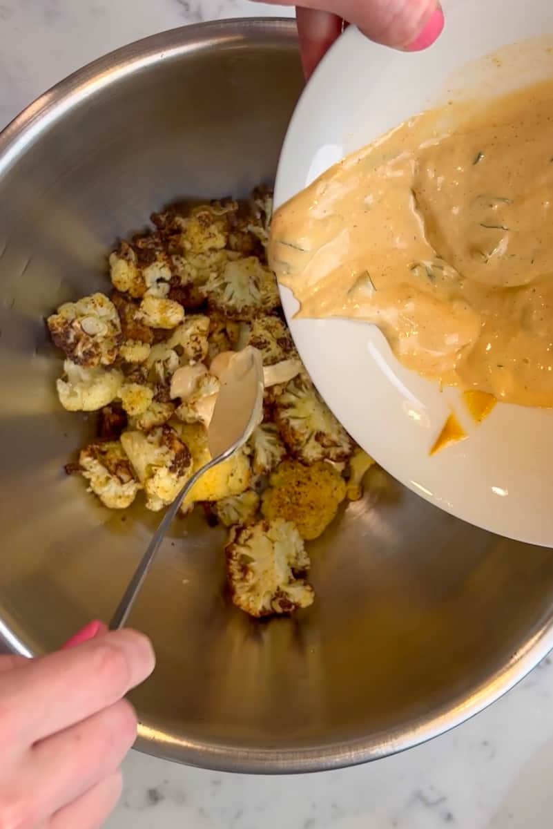When the cauliflower is brown, add into the large bowl of condiments. Stir well to combine.