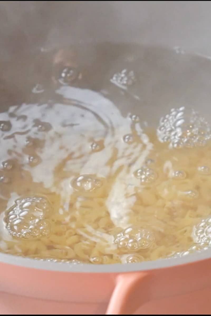 Add the pasta to the water and boil until al dente. Reserve one cup of pasta water, then drain the pasta and add to the warm skillet. Stir for a minute.