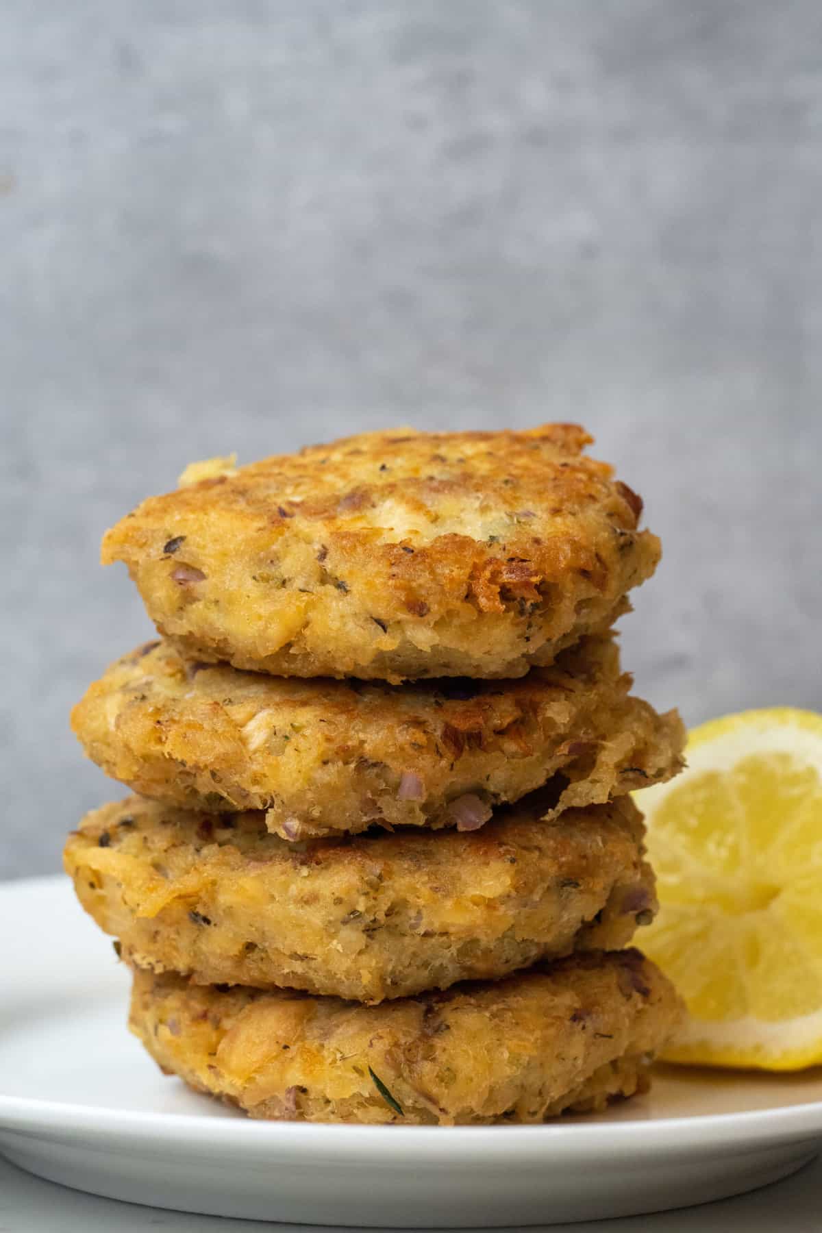 These Tuna Patties Recipe are made with tuna from a can, onion, chives, mayonnaise, crumbs, oregano, vinegar and baked to perfection. 