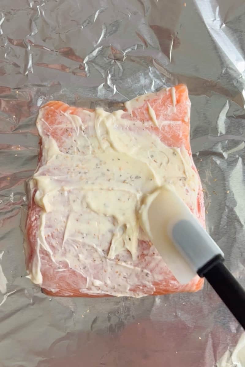 Preheat the oven to 400°F. Prepare a baking sheet with parchment paper and spray with nonstick cooking spray. Arrange the fillets onto the sheet. In a bowl, add the mayonnaise and the cajun seasoning and mix.