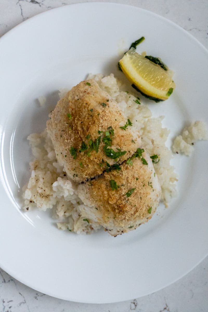 This Baked Flounder Florentine is made with flounder, olive oil, onion, spinach, bread crumbs, white wine and parsley.