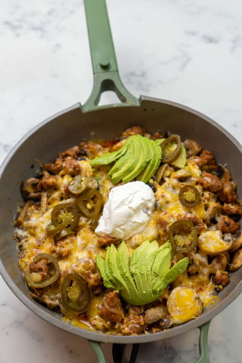 This Sausage and Mushroom Casserole is made with Italian sausage, onion, mushrooms, jalapeños, cheese, avocado and sour cream.