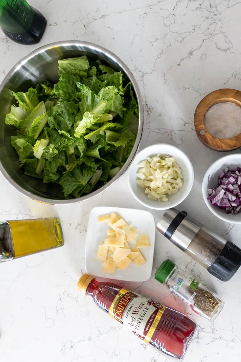 This Fennel Salad Recipe is made with olive oil, red wine vinegar, oregano, fennel, red onion, parmesan and tossed in chopped romaine.