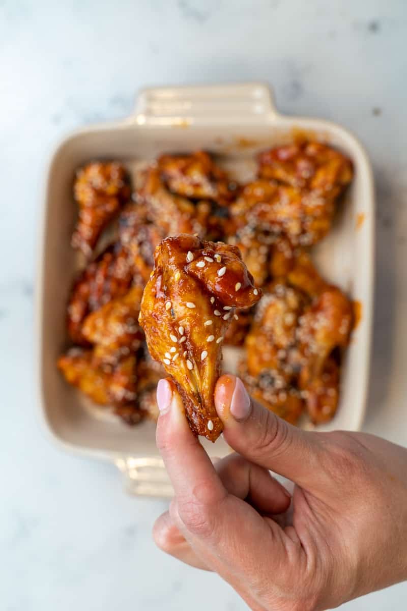 This Gochujang Chicken Wings Recipe (Air Fryer or Oven) is made with bone-in chicken, seasoning, gochujang paste, soy sauce, ginger, rice vinegar, sesame oil and baked to perfection.