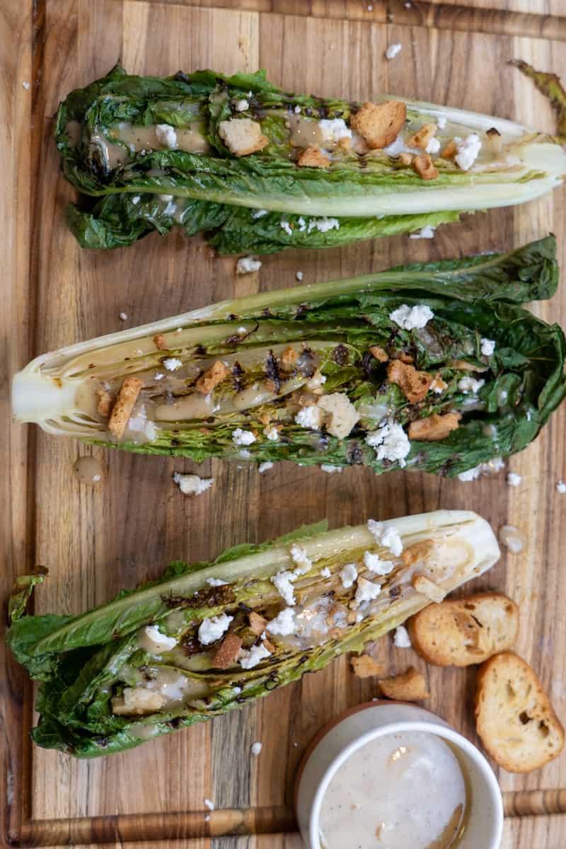 By grilling the romaine lettuce, you get a nice smokey, charred taste and it complements the lettuce so much. 