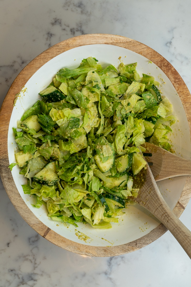 This Green Goddess Salad recipe is made with iceberg lettuce, cucumbers, chives, scallions, and tossed in a homemade green goddess dressing.