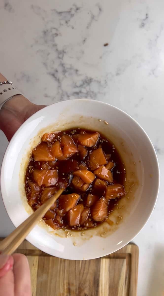 For the salmon, dice into small pieces and add to a bowl with the soy sauce, sesame oil, rice vinegar, and sesame seeds.