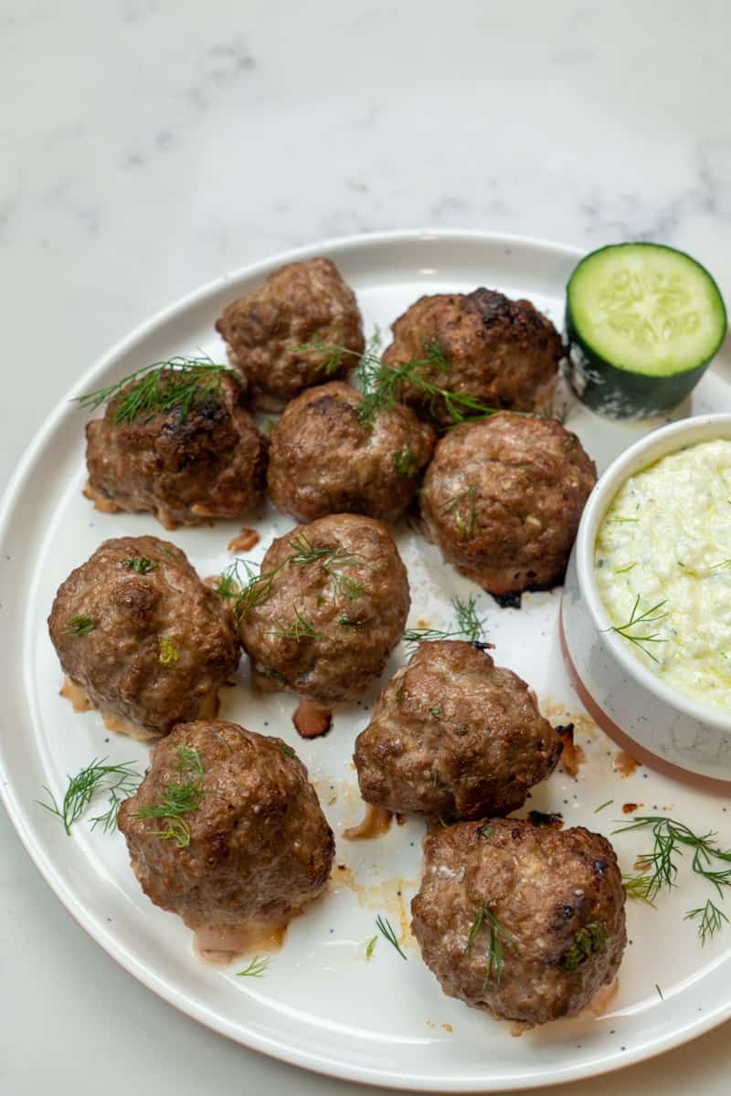 These Lamb Meatballs Tzatziki is created by making a homemade tzatziki sauce and deliciously baked lamb meatballs.