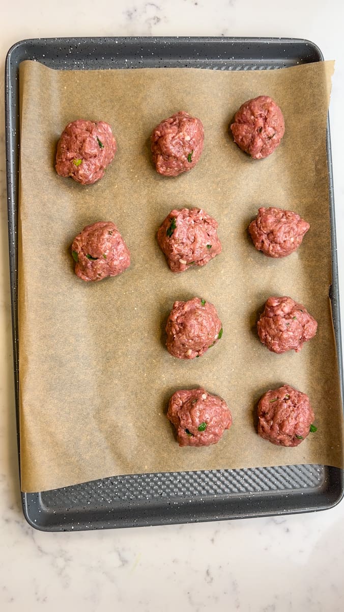 Place the meatballs on a prepare baking sheet lined with parchment paper. Bake in the oven for 20-25 minutes.