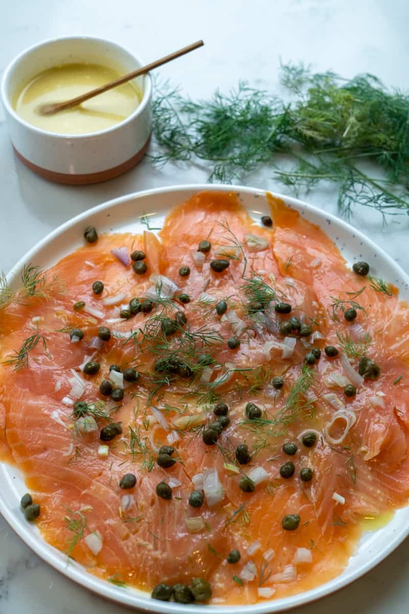This Salmon Carpaccio is made with fresh salmon, lemon, shallots, dill, capers and a homemade mustard dressing.