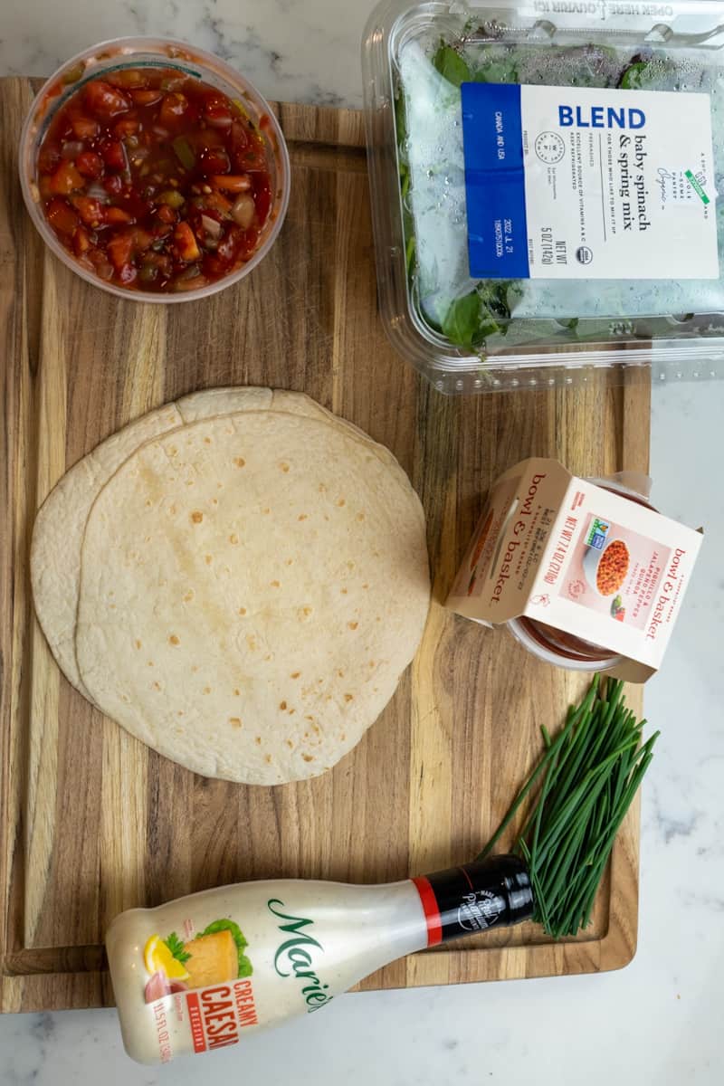 These Vegan Tofu Wraps are made with store bought vegan Caesar dressing, flour tortillas, baked tofu, and topped with lettuce and pico de gallo.