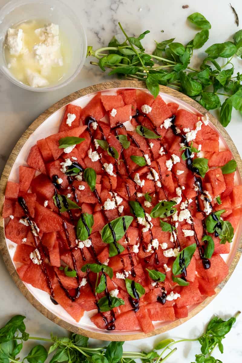 This Watermelon Feta Basil Balsamic Salad is a perfect summer recipe and is made with watermelon, basil, feta and balsamic glaze. 