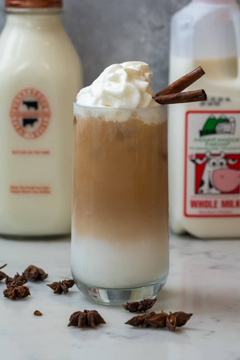 This Iced Chai Latte Starbucks Recipe is made with chai tea bags, milk and sweetener of your choice, ice, water and whipped cream.