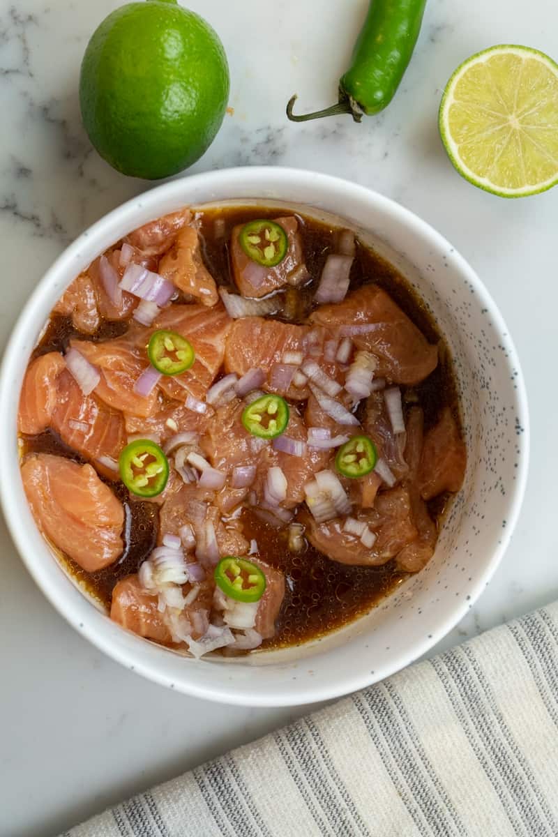 This Salmon Crudo is made with salmon, shallots, serrano peppers, lime juice, sesame oil, soy sauce, and ponzu sauce.