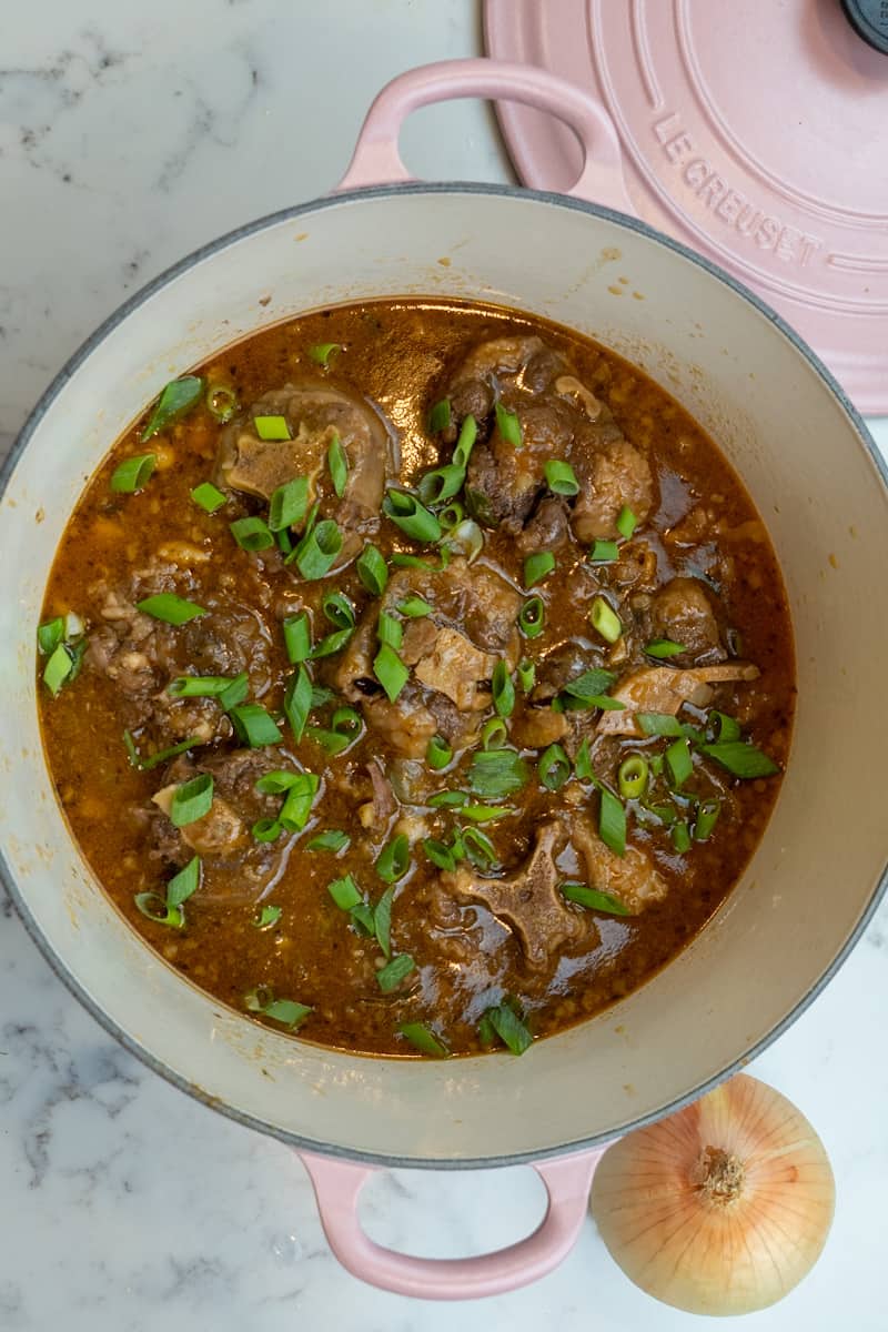 These Oxtails and Butter Beans are made with oxtails, onions, garlic, ginger, pepper, green onion, butter beans and simmered to perfection.