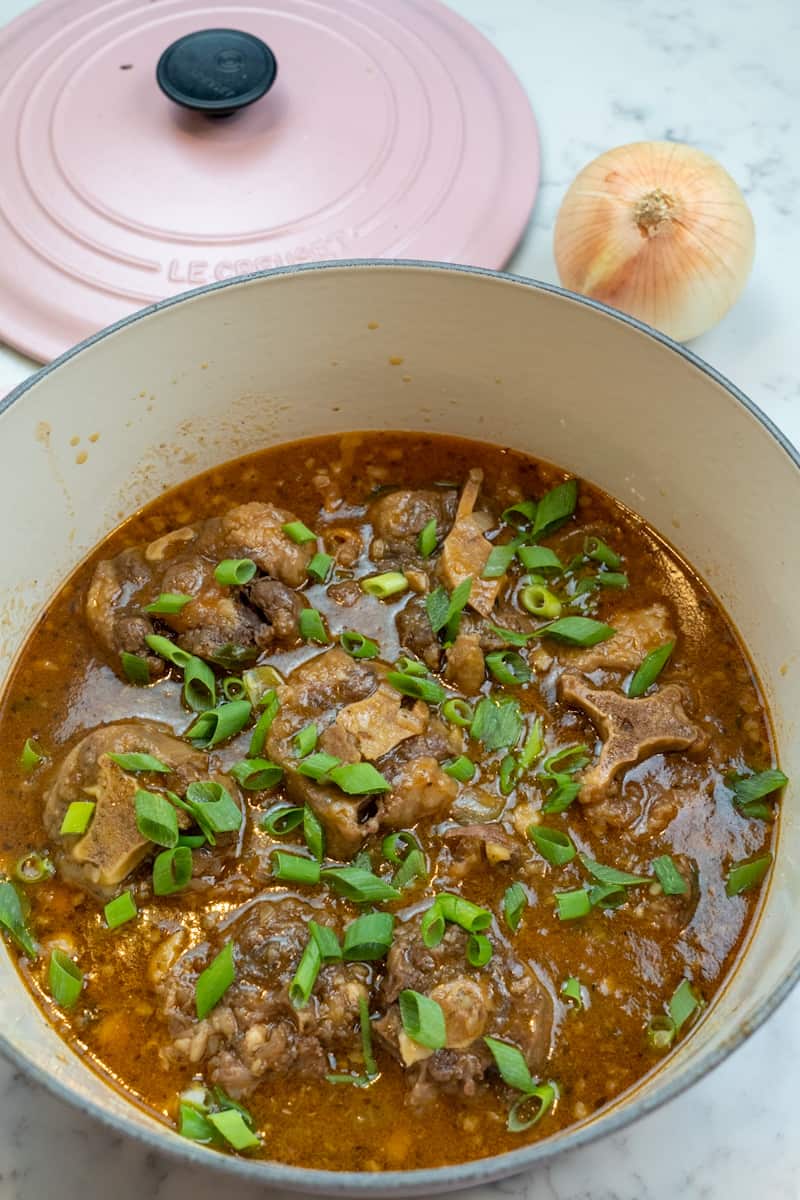 These Oxtails and Butter Beans are made with oxtails, onions, garlic, ginger, pepper, green onion, butter beans and simmered to perfection.