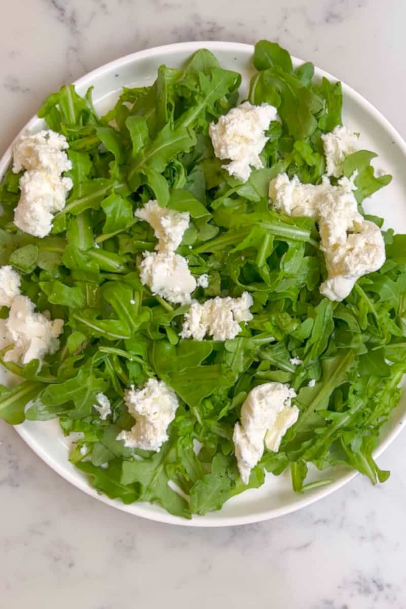 Pull the burrata to break them up into little pieces.